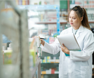 pharmacist taking stock of inventory